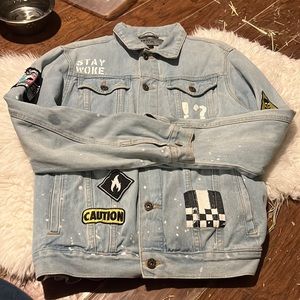 Jean jacket with patches and paint splatter
